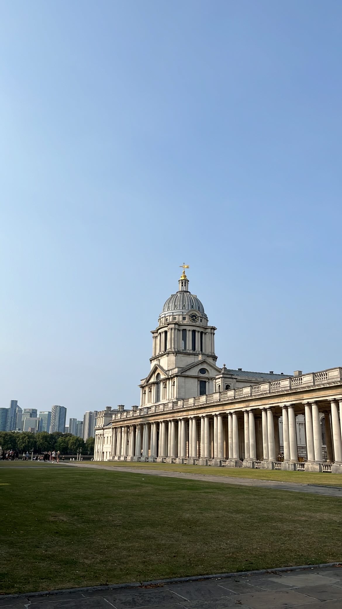 The King William Dome of the Old Royal Naval College, with its intricate clock and towering neoclassical architecture.